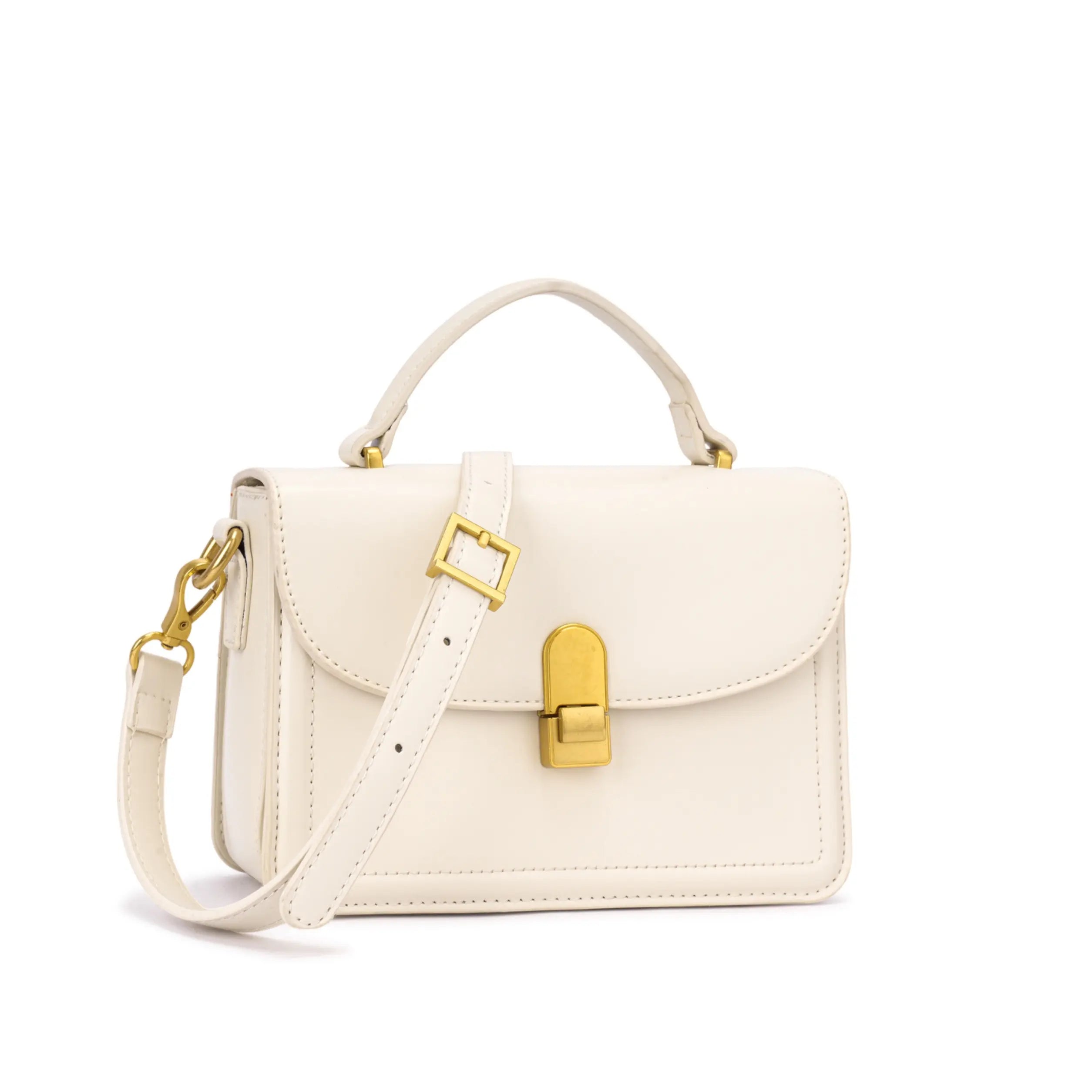Bolsa de mão Livia na cor branca off-white, destacando seu formato estruturado minimalista, costuras alinhadas e fecho frontal de encaixe em metal dourado. Preto Caramelo Off White Vermelho