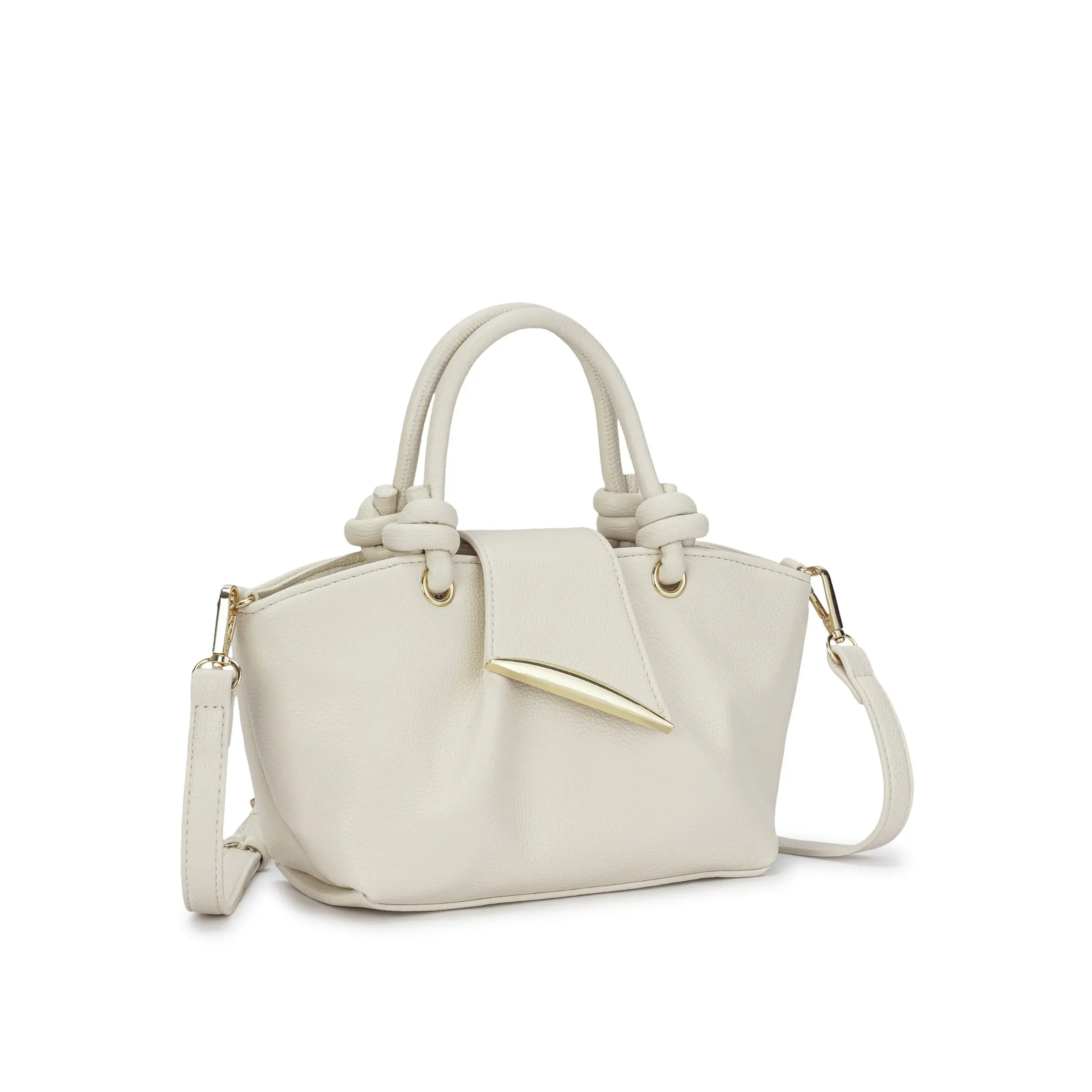 Visão frontal da Bolsa Mini Tote Luna off-white, destacando o formato estruturado e o contraste suave do couro claro com os metais dourados. Preto Caramelo Off White